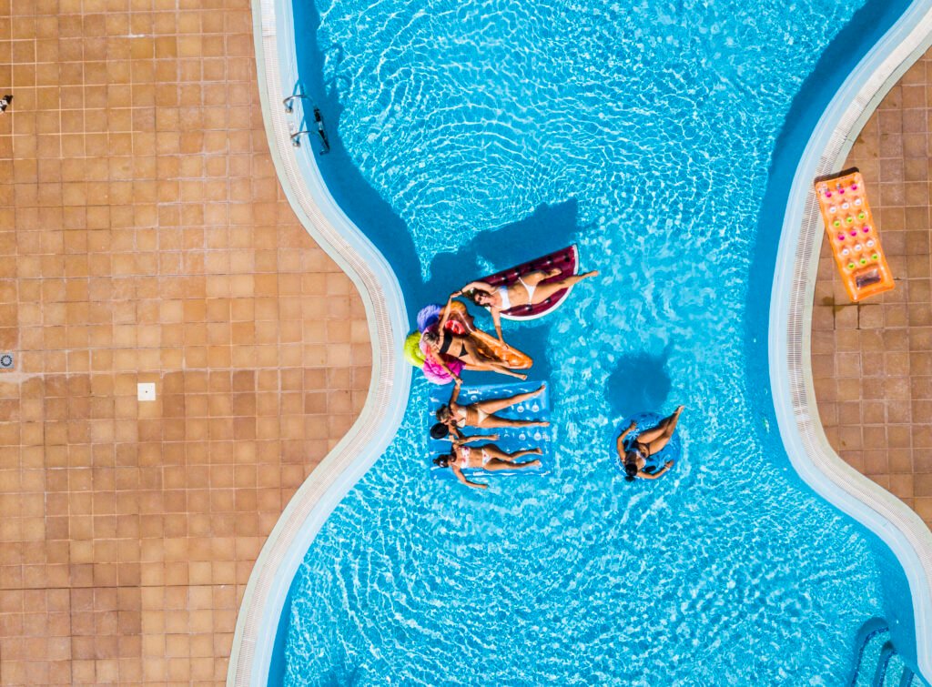 Aerial vertical view of group of women friends have fun together